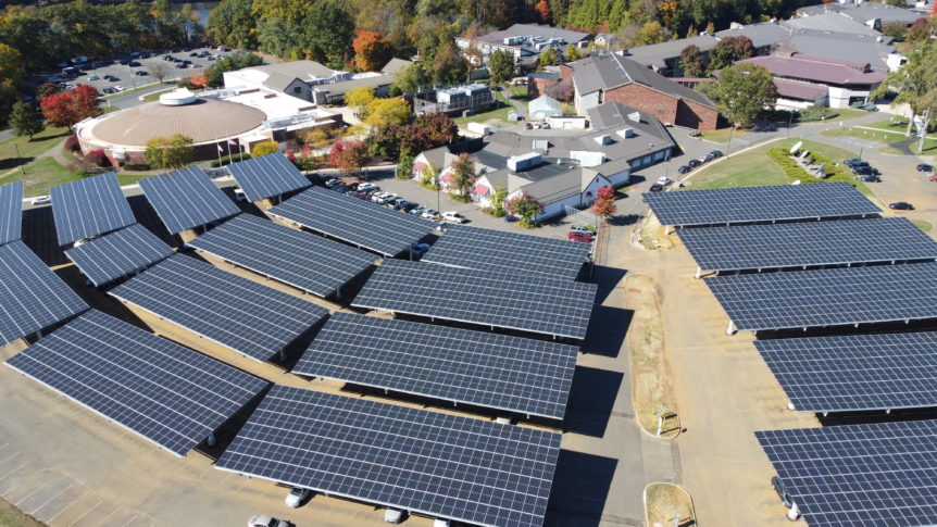 Green Ribbon Cutting Solar Panels from Drone